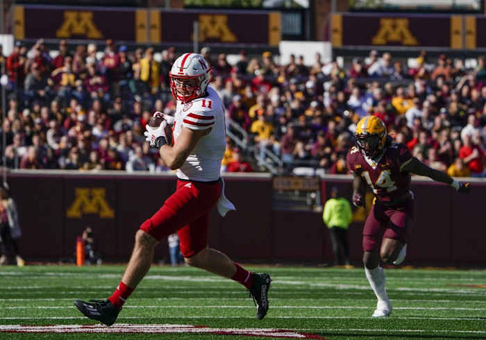 Oct 16, 2021; Minneapolis, Minnesota, USA; Nebraska Cornhuskers tight end Austin Allen (11) runs with the ball after the catch against the Minnesota Golden Gophers during the third quarter at Huntington Bank Stadium.